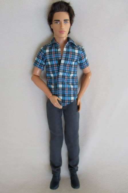 BARBIE - A STUNNING DARK HAIRED MATTEL KEN DOLL WITH ARTICULATED ELBOWS AND WRISTS