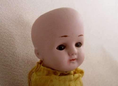 STRAIGHT OUT OF THE ATTIC - AN ANTIQUE GERMAN BISQUE DOLL WITH OPEN/CLOSE EYES  TO RESTORE!!
