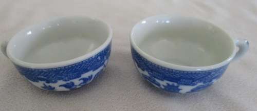 TWO VINTAGE MINIATURE BLUE AND WHITE WILLOW PATTERN PORCELAIN CUPS, SAUCERS AND CAKE PLATES (TRIOS)