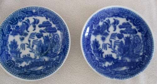TWO VINTAGE MINIATURE BLUE AND WHITE WILLOW PATTERN PORCELAIN CUPS, SAUCERS AND CAKE PLATES (TRIOS)