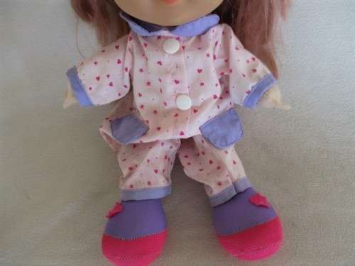 A CUTE SOFT BODIED LUCKY IND. DOLL WITH BRATZ-LIKE EYES AND A CHEEKY SMILE