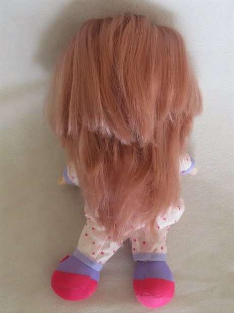 A CUTE SOFT BODIED LUCKY IND. DOLL WITH BRATZ-LIKE EYES AND A CHEEKY SMILE