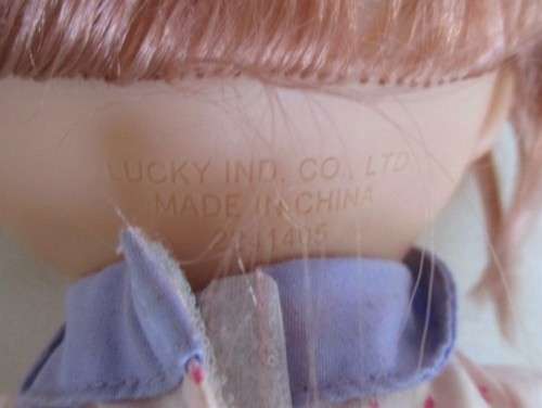 A CUTE SOFT BODIED LUCKY IND. DOLL WITH BRATZ-LIKE EYES AND A CHEEKY SMILE