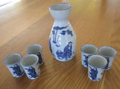 SEVEN PIECE ORIENTAL SAKE SET - SIGNED ON BASE