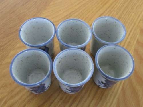 SEVEN PIECE ORIENTAL SAKE SET - SIGNED ON BASE