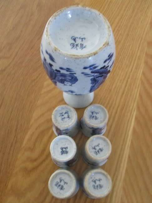 SEVEN PIECE ORIENTAL SAKE SET - SIGNED ON BASE