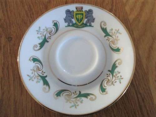 VINTAGE AND HISTORICAL - FORMER HOMELAND VENDA CUP AND SAUCER DEPICTING VENDA COAT OF ARMS