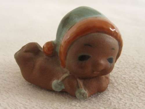 MORE BARGAINS - FOUR TINY VINTAGE CERAMIC KEWPIE DOLLS