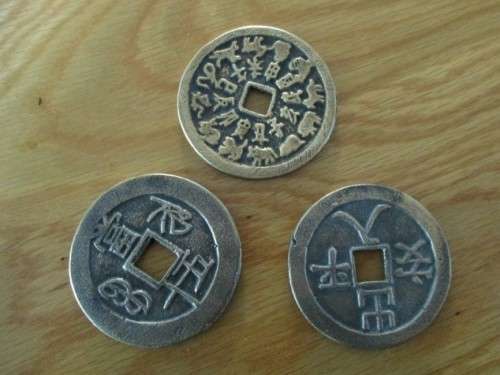 THREE VINTAGE CHINESE? BALINESE? COINS
