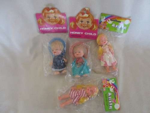 FOUR VINTAGE 1980's DOLLIES STILL SEALED IN ORIGINAL PACKAGING