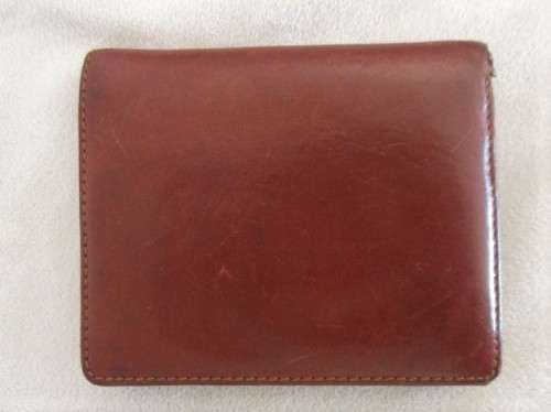 A VINTAGE REAL CALF LEATHER WALLET