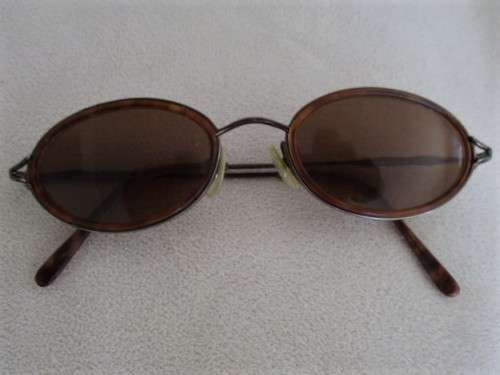 TWO PAIRS OF VINTAGE SUNGLASSES - CALVIN KLEIN AND GIORGIO ARMANI?