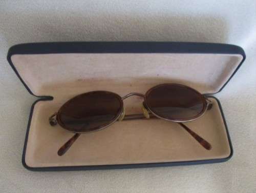TWO PAIRS OF VINTAGE SUNGLASSES - CALVIN KLEIN AND GIORGIO ARMANI?