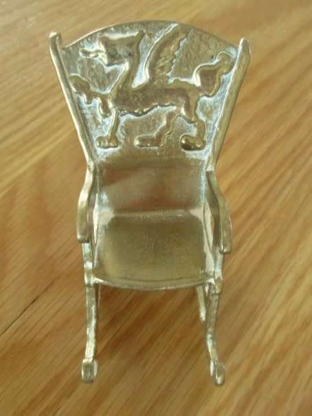 SMALL ORNAMENTAL SOLID BRASS ROCKING CHAIR
