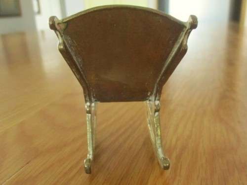 SMALL ORNAMENTAL SOLID BRASS ROCKING CHAIR