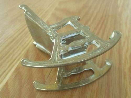 SMALL ORNAMENTAL SOLID BRASS ROCKING CHAIR
