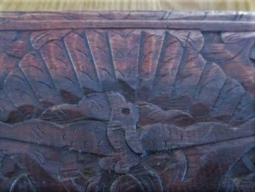A VINTAGE INTRICATELY CARVED WOODEN BOX
