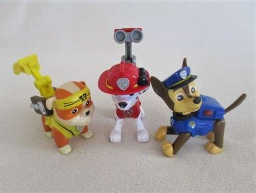 THREE CUTE SMALL HARD PLASTIC DOGS IN OUTFITS