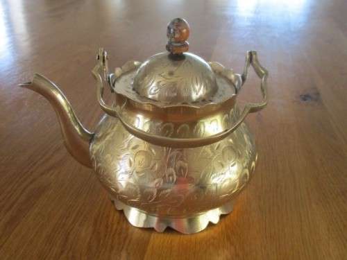 A DECORATIVE VINTAGE INDIAN BRASS TEAPOT - BEAUTIFULLY ETCHED WITH FLORAL DESIGN