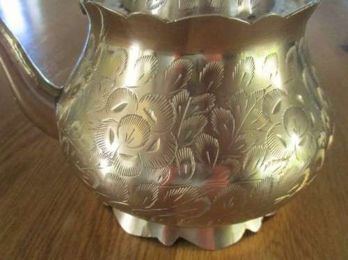 A DECORATIVE VINTAGE INDIAN BRASS TEAPOT - BEAUTIFULLY ETCHED WITH FLORAL DESIGN