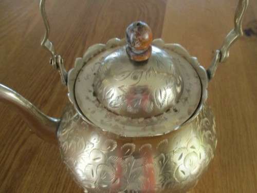 A DECORATIVE VINTAGE INDIAN BRASS TEAPOT - BEAUTIFULLY ETCHED WITH FLORAL DESIGN