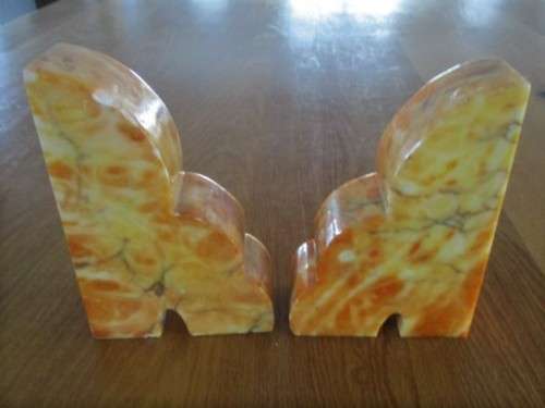 A PAIR OF HEAVY AMBER HONEY ONYX? BOOKENDS