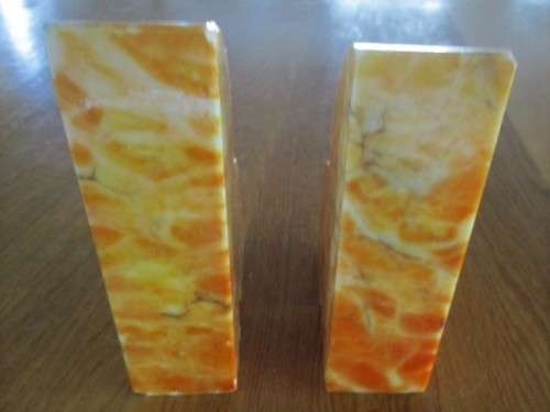 A PAIR OF HEAVY AMBER HONEY ONYX? BOOKENDS