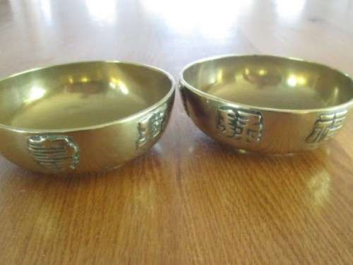 TWO SMALL VINTAGE CHINESE BRASS BOWLS WITH RAISED DRAGON AND CHINESE SYMBOL OF HAPPINESS