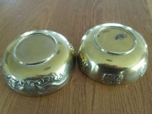 TWO SMALL VINTAGE CHINESE BRASS BOWLS WITH RAISED DRAGON AND CHINESE SYMBOL OF HAPPINESS