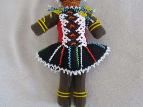 A SMALL VINTAGE HAND MADE TRADITIONAL ZULU BLACK CLOTH DOLL WITH INTRICATE BEADWORK