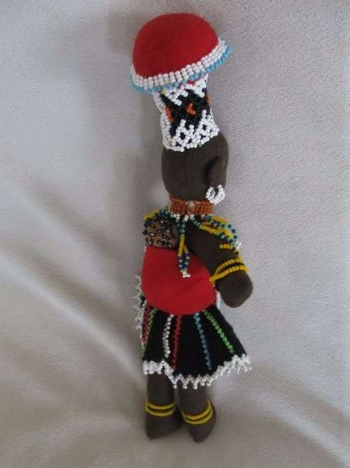 A SMALL VINTAGE HAND MADE TRADITIONAL ZULU BLACK CLOTH DOLL WITH INTRICATE BEADWORK