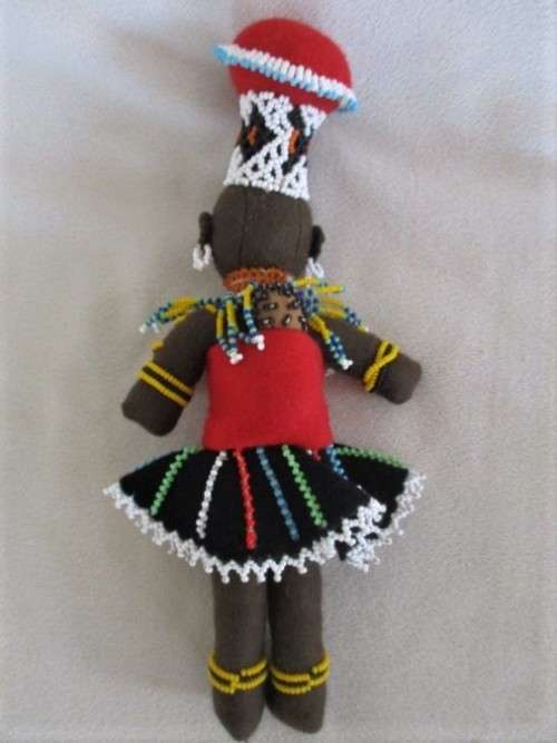 A SMALL VINTAGE HAND MADE TRADITIONAL ZULU BLACK CLOTH DOLL WITH INTRICATE BEADWORK