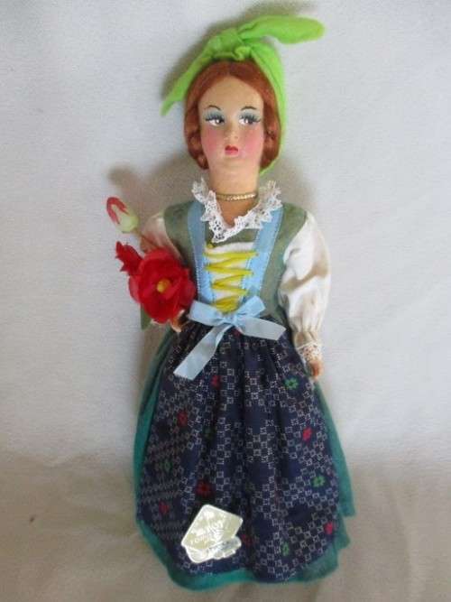 A SMALL VINTAGE ITALIAN DOLL WITH COMPOSITION HEAD AND PLASTIC BODY
