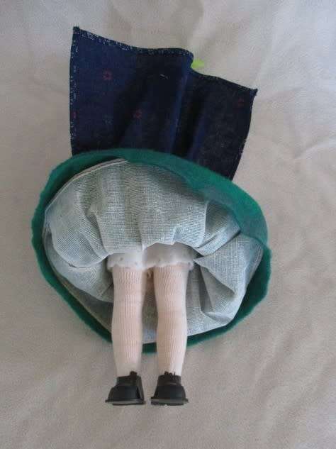 A SMALL VINTAGE ITALIAN DOLL WITH COMPOSITION HEAD AND PLASTIC BODY