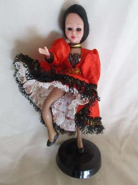 A PRETTY SMALL VINTAGE CAN-CAN DOLL ON STAND