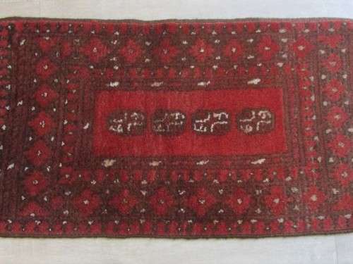 A HAND MADE AFGHAN CARPET/PRAYER MAT - 103CM X 48CM (1030MM X 480MM)