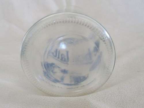 A DECORATIVE VINTAGE FRENCH MILK BOTTLE