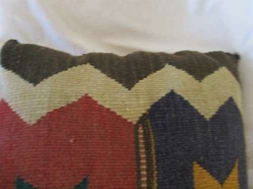 A VINTAGE HAND WOVEN MIDDLE EASTERN CUSHION - OLD COVERTED SADDLE BLANKET?
