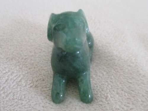 A TINY CHINESE JADE DOG