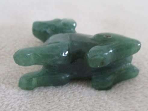 A TINY CHINESE JADE DOG