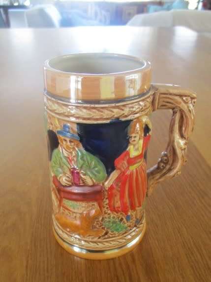 A HAND PAINTED GERMAN STEIN