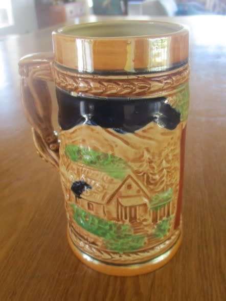 A HAND PAINTED GERMAN STEIN