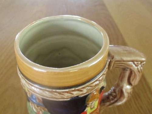 A HAND PAINTED GERMAN STEIN