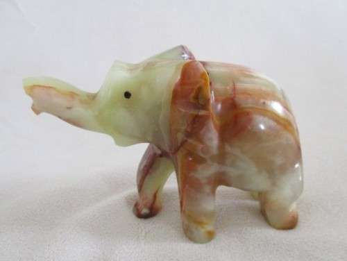 A BEAUTIFUL CARVED GREEN ONYX ELEPHANT