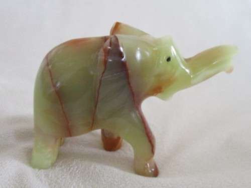 A BEAUTIFUL CARVED GREEN ONYX ELEPHANT