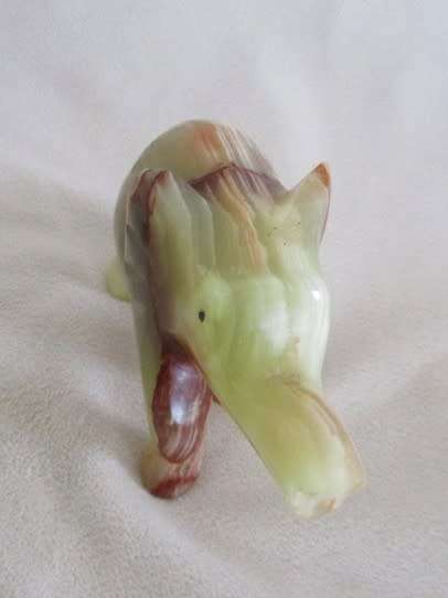 A BEAUTIFUL CARVED GREEN ONYX ELEPHANT