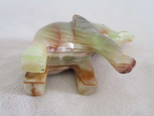 A BEAUTIFUL CARVED GREEN ONYX ELEPHANT