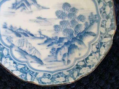 A BLUE AND WHITE ORIENTAL PIN DISH - SIGNED