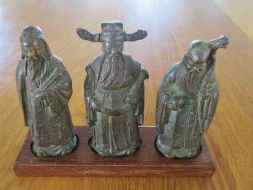 THREE ANTIQUE HEAVY, SOLID BRONZE FIGURES OF CHINESE IMMORTALS ON WOODEN STAND