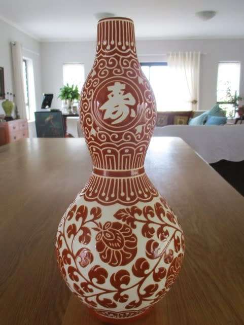 LARGE CORAL RED CHINESE DOUBLE GOURD VASE WITH CHINESE SYMBOLS AND FLORAL DESIGN - SIGNED